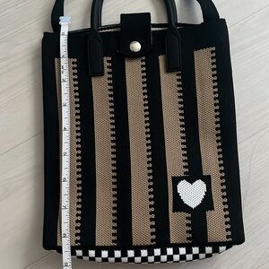 Woven polyester jacquard crossbody bag 

7.5 inch x 8.5 inch